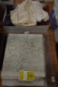 A quantity of Honiton and other lace, Ikat silk trousers and skirt etc together with a piece of