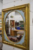 A decorative gilt framed mirror.