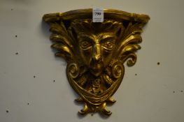 A pair of carved gilt wood wall brackets.
