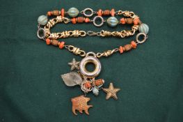 Decorative necklace with turquoise and coral sections.