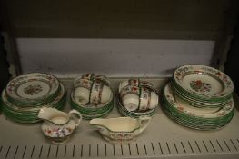 A quantity of Copeland Spode Chinese Rose dinnerware and eight cups and saucers, side plates etc.