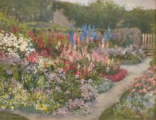 Guy Kortright (1877-1939), a pair of oil on canvas garden scenes with abundant flowers in full