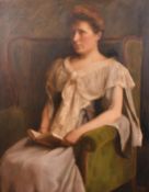 Kenneth Edwin Wootton (1885-1974), a portrait of a seated lady holding a book, oil on canvas, signed