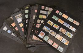 TWENTY-ONE SHEETS OF BRITISH AND BRITISH COMMONWEALTH STAMPS, Victoria to Elizabeth II.