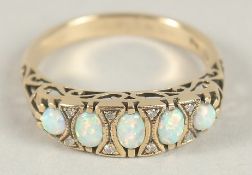 A 9CT GOLD OPAL AND DIAMOND RING.