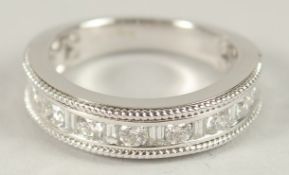 A HEAVY 18CT WHITE GOLD, BRILLIANT AND BAGUETTE DIAMOND HALF HOOP RING.