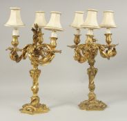 A VERY GOOD PAIR OF LOUIS XVI STYLE ORMOLU THREE-BRANCH CANDELABRA, with acanthus and scrolls. 46cms