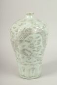 A CHINESE CELADON GLAZE PORCELAIN MEIPING DRAGON VASE. 33cms high.