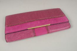 A VINCE CAMUTO PURPLE SUEDE CLUTCH BAG. 33cms long x 17cms deep.