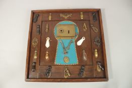 A FRAMED COLLECTION OF LOCKS, KEYS, ESCUTCHEONS. 44cms x 46cms.