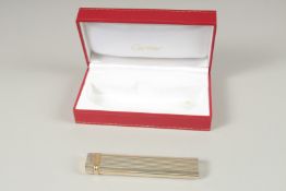A GOOD CARTIER LONG LIGHTER. Stamped Cartier, Paris, No. 80873. 12.5cms long, in a Red Cartier Box.