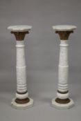 A GOOD PAIR OF WHITE MARBLE COLUMNS with octagonal tops and bases. 120cm high.