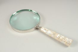 A LARGE MAGNIFYING GLASS, 15cms with mother-of-pearl handle.