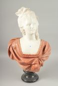 A GOOD CARVED TWO COLOUR MARBLE BUST OF A LADY, on a circular base. 64cm high.
