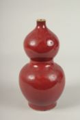 A CHINESE RED DOUBLE GOURD VASE. 26cms high.