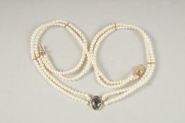 A TWO ROW PEARL AND BLACK OPAL NECKLACE.