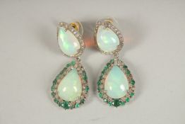 A SILVER AND GOLD PAIR OF OPAL, EMERALD AND DIAMOND DROP EARRINGS.