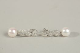 A PAIR OF 18CT WHITE GOLD LONG DROP DECO-STYLE EARRINGS set with cultured pearls and RBC and