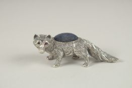 A SILVER PIN CUSHION 