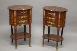 A PAIR OF FRENCH STYLE MAHOGANY AND MARQUETRY OVAL SHAPE FOUR-DRAWER BEDSIDE CHESTS with an under