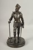 A GOOD BRONZE OF A KNIGHT in armour, carrying a sword, on a circular base. 40cms high.