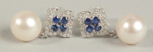 A PAIR OF 18CT WHITE GOLD DROPLET EARRINGS set with suspended pearls. with sapphire and diamonds