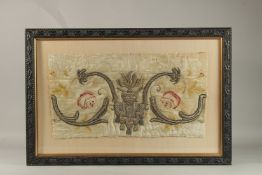 AN EARLY 17TH CENTURY ECCLESIASTICAL STUMPWORK, the centre with a red heart. 29cms x 53cms.