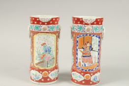 A PAIR OF JAPANESE IMARI CIRCULAR VASES. 26cms high.