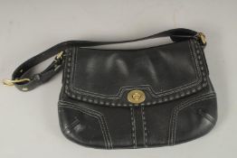 A COACH BLACK LEATHER BAG with strap. 26cms long x 17cms deep.