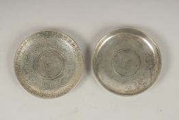 TWO CHINESE COIN DISHES. 9cms diameter.