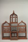 A LARGE WOODEN BIRDCAGE. 82cms high x 66ms wide.