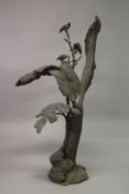 A LARGE CAST BRONZE FLOOR STANDING SCULPTURE depicting birds on a tree. 147cms high.