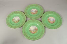 A SET OF FOUR ROYAL WORCESTER CIRCULAR GREEN PLATES the centres painted with a college and