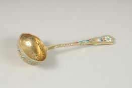 A RUSSIAN SILVER GILT AND ENAMEL SIFTER SPOON. Mark 84. 7cms long. Weight 77gms.