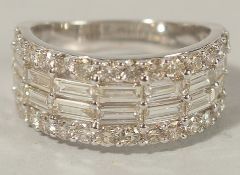 A 9CT WHITE GOLD DIAMOND BAND set with RBC and baguette cut diamonds. Diamonds 2.72ct.