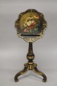 A GOOD VICTORIAN PAPIER MACHE WRITING STAND, edged in gilt and painted with flowers on a ring