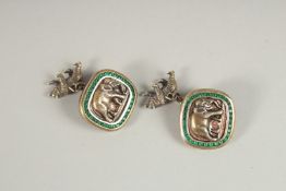 A PAIR OF RUSSIAN SILVER AND EMERALD ELEPHANT CUFFLINKS. Mark Head 88, Faberge. Weight 26gms.
