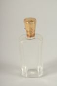 AN 18TH CENTURY GOLD TOP SCENT BOTTLE in a leather case.