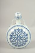 A CHINESE BLUE AND WHITE TWIN-HANDLE MOON FLASK. 31cms high.