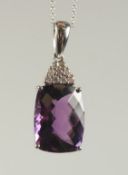 A GOOD AMETHYST AND DIAMOND PENDANT on a fine white 14ct gold chain.