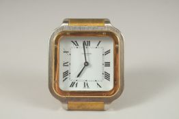A GOOD CARTIER TRAVELLING CLOCK. Quartz, No. 7508 17637. 7cms x 7cms, in a Red Cartier folding bag.