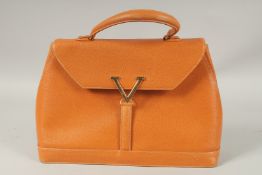 A VALENTINO ORANGE LEATHER BAG with brass 