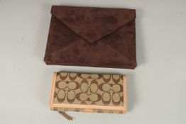 A SUEDE CLOTH BAG, 25cms long x 18cms deep; and a PURSE, 20cms x 10cms.