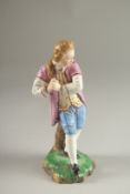 A GOOD HOCHST PORCELAIN FIGURE OF A YOUNG MAN. Circle mark in blue. 17cms high.