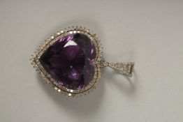 A SILVER SET LARGE AMETHYST AND DIAMOND PENDANT.