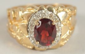 A GOOD YELLOW GOLD RUBY AND DIAMOND FANCY RING.