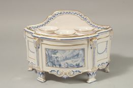 A TULIP POT OR CROCUS POT, the serpentine front painted with a pastoral scene, on four pad feet.