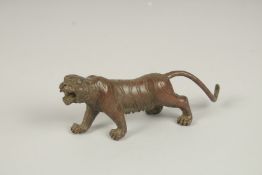 A JAPANESE BRONZE TIGER. 13cms long.