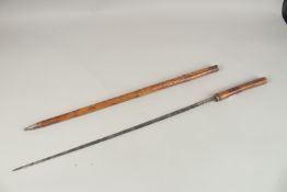 AN EARLY SWORD STICK in a bamboo case. 90cms long.