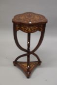 A FRENCH STYLE ROSEWOOD AND MARQUETRY SHAPED TOP OCCASIONAL TABLE, with a small drawer, on curving